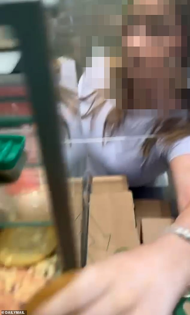 Pictured: The feral 14-year-old swiping a cookie from behind the Subway counter
