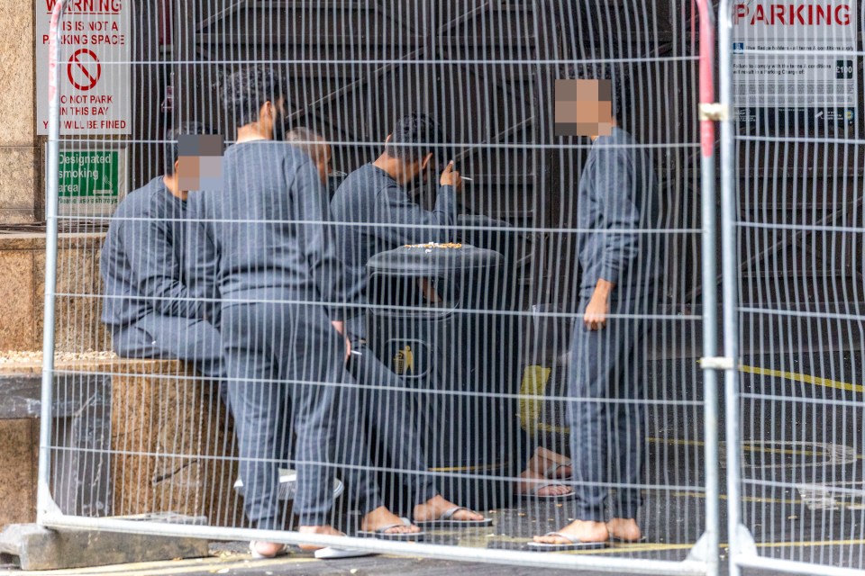 Migrants outside a London hotel.