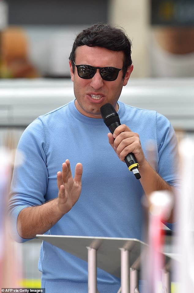 US political commentator Joey Mannarino speaks to a far-right demonstration