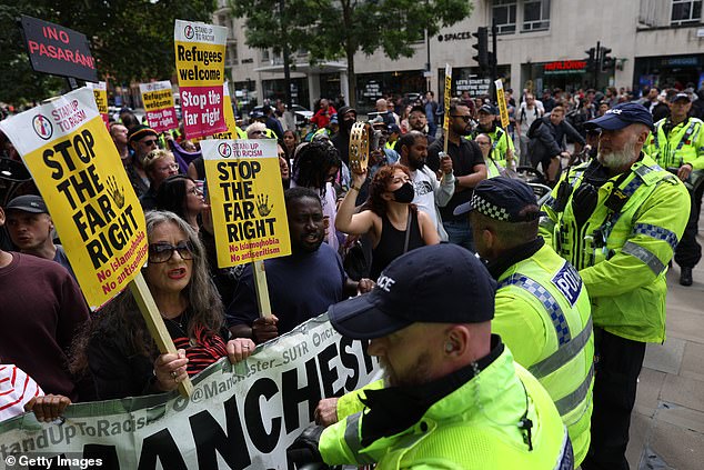 Police lined up to separate the two groups during the protest in Manchester