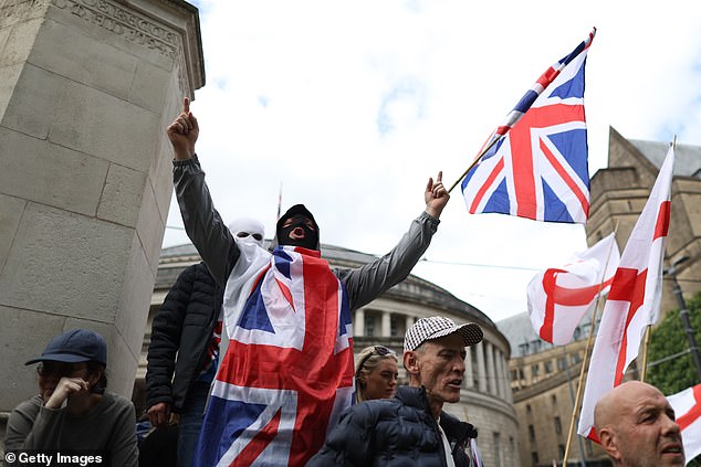 MANCHESTER: Some wore balaclavas and were flying St George or Union Jack flags