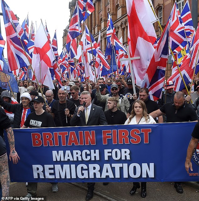 MANCHESTER: Far-right Britain First party co-leaders Paul Golding, in suit and Ashlea Simon, to his right, lead supporters on an anti-immigration protest