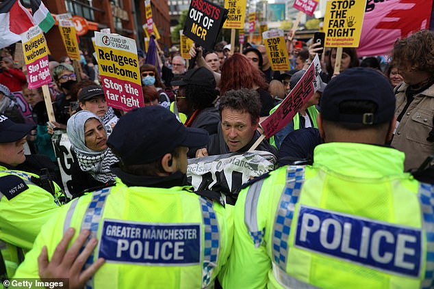 MANCHESTER: Police form a line in front of counter-protestors from Stand Up to Racism