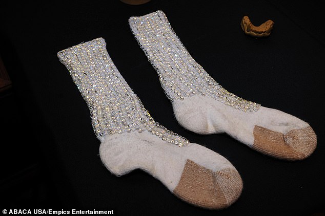 A dirty sock once worn by Michael Jackson has raised a staggering £6,600 at an auction in France