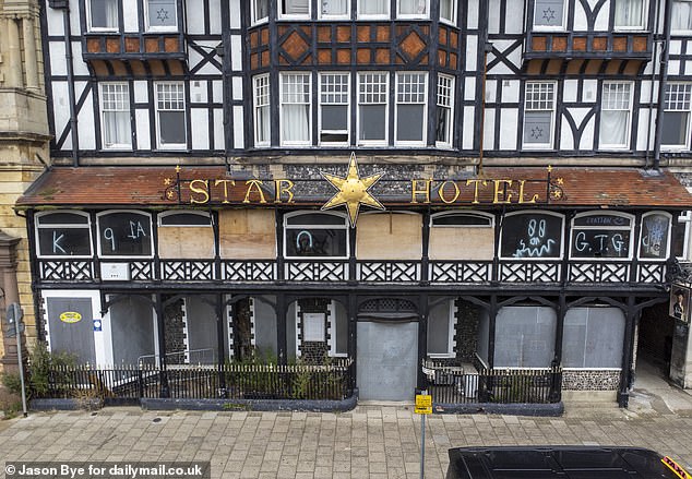 Fire damage and graffiti can be seen on the exterior of the Star Hotel. The grade-II listed building has been riddled with crime since its closure in 2020