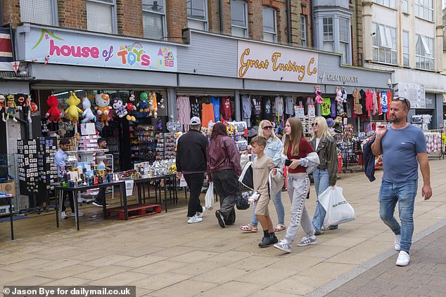 Souvenir and candy shops remain open along the promenade as summer holidaymakers visit the famous Britannia Pier