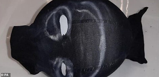 Pictured: a mask recovered from Hunt's home by Avon and Somerset Police as part of their investigation. Officers also found a journal in which he had written a story about someone called Jack who purchases a black rubber suit and mask with white paint on the mask