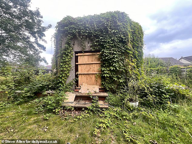 AFTER: An outhouse building is now barricaded with makeshift defences to deter youths