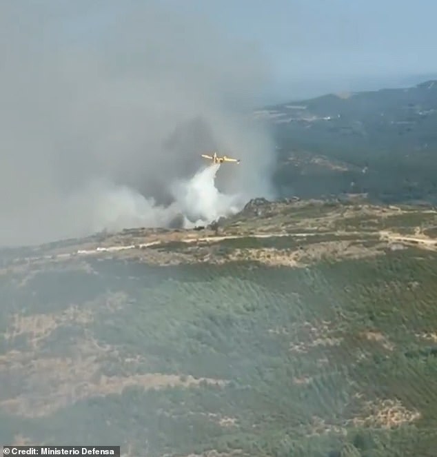 Aeroplanes have been deployed to shower water over the raging fires as emergency services struggle to keep the fires across Spain under control