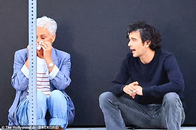 Denise was seen blowing her nose as her supportive son sat close by
