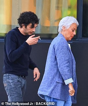 The pair looked downcast as they strolled together