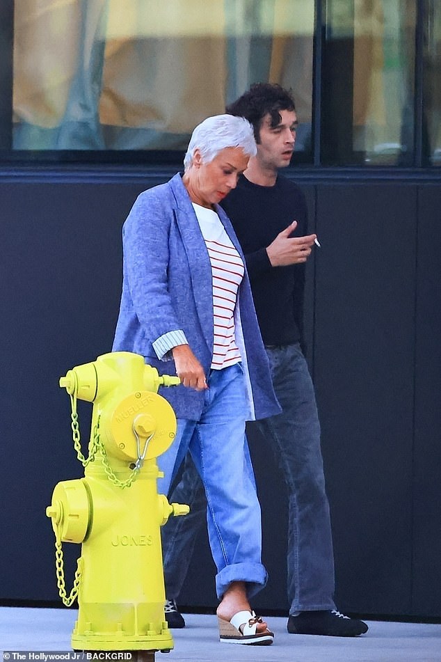 The TV personality cut a chic figure in a blue blazer, jeans and white wedge sandals