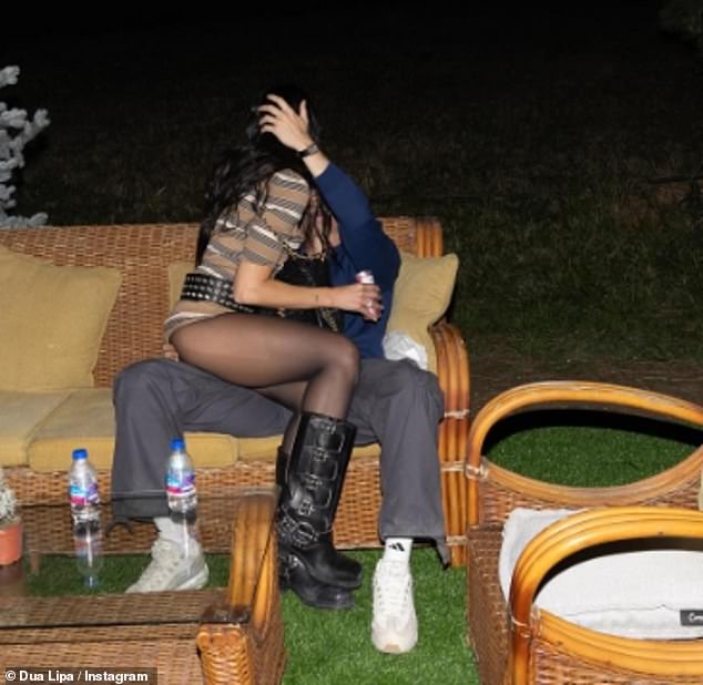 The One Kiss singer, 29, who can be seen sitting on boyfriend Callum Turner's lap, seemed elated as she shared an album of snaps to Instagram on Saturday to share her exciting news