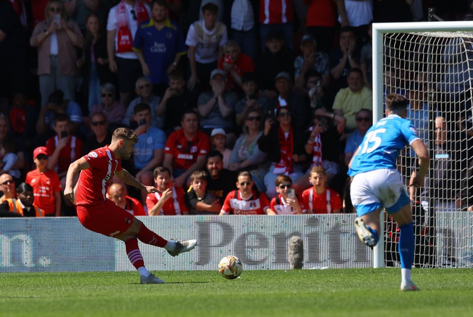 Soccer player taking a penalty kick.