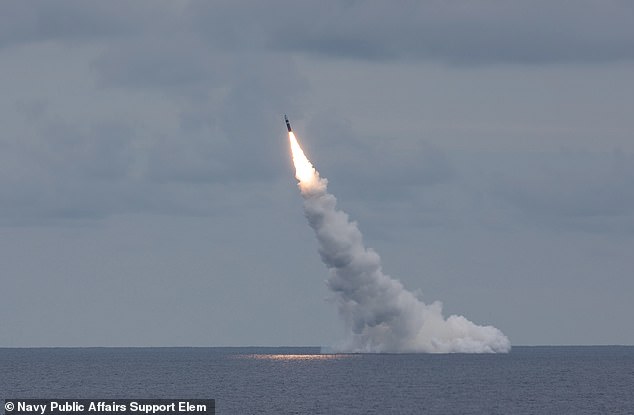 An unarmed Trident II D5LE missile launches from the Ohio-class ballistic missile submarine USS Wyoming