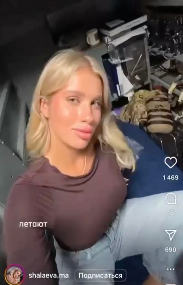 Woman with blonde hair in a mauve top and jeans.