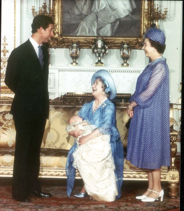 The Queen Mother holds baby William with the Queen and Charles in the Music Room