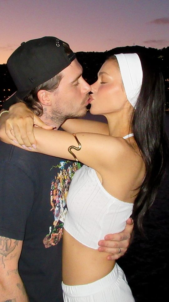 Brooklyn Beckham and Nicola Peltz kissing.
