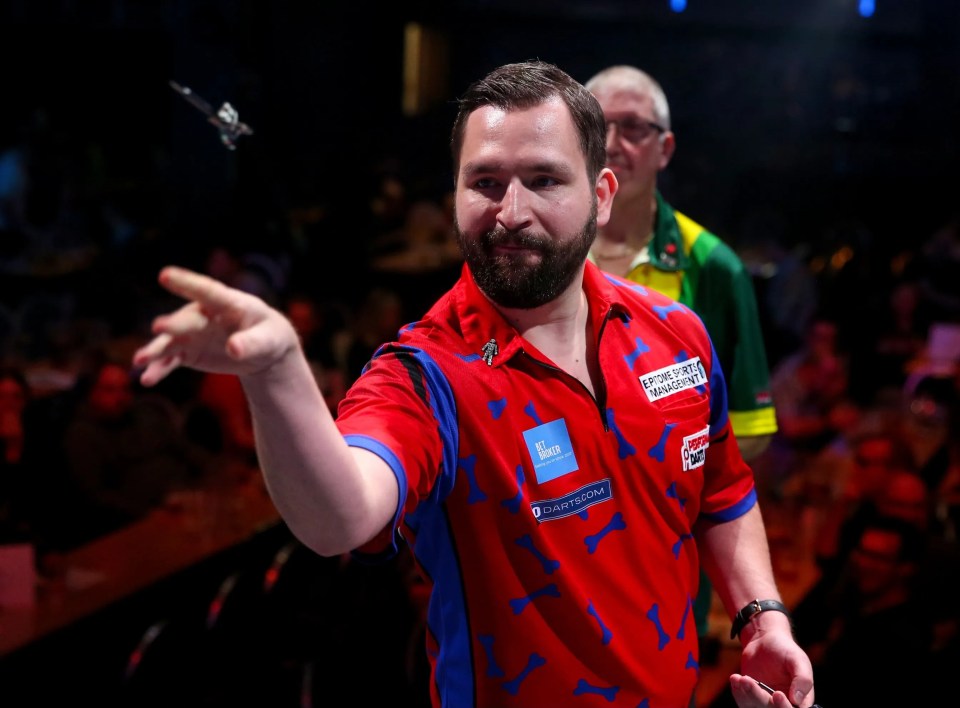 Adam Smith-Neale throwing a dart at the BDO World Professional Darts Championships.