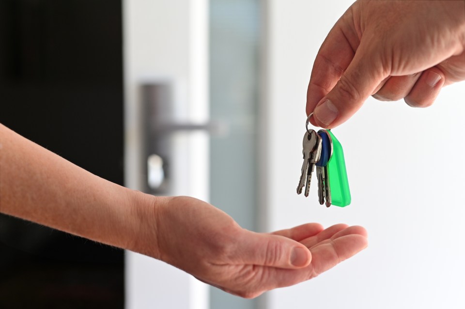 Handing over house keys.