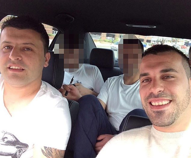 Klevis Hoxhosmani in a car with his brother, Artur, who was also arrested on Saturday