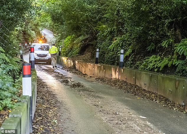 Dorset Council is planning £8 million of work to sbabalise the road. Pictured: The steep one-way section of Dinah's Hollow