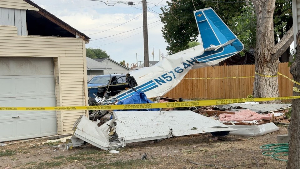 Plane crash debris in a yard.