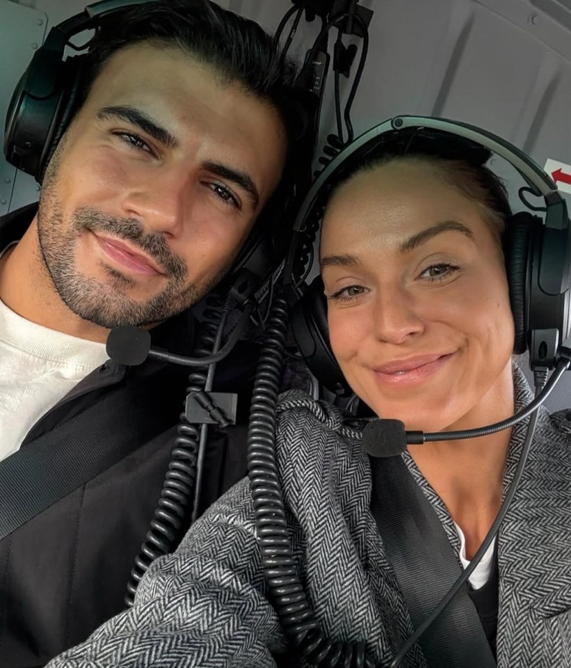 Vicky Pattison and a man wearing headsets in a helicopter.