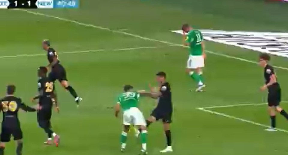 Bruno Guimaraes avoids a red card during a soccer match.