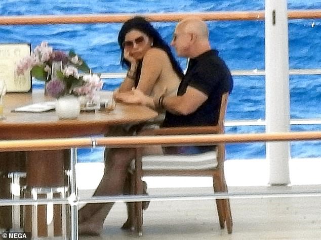 The boat comes complete with three decks, a pool, a helipad, three Jacuzzis, and a sun terrace - perfect for the 18 guests it can accommodate (Jeff and wife Lauren Sanchez relaxing onboard)