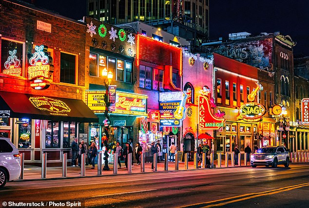 Famous Neon signs of blues clubs on Beale street illuminated at night in downtown Nashville. People will be able to get from the airport to downtown in just 8 minutes in the new tunnel