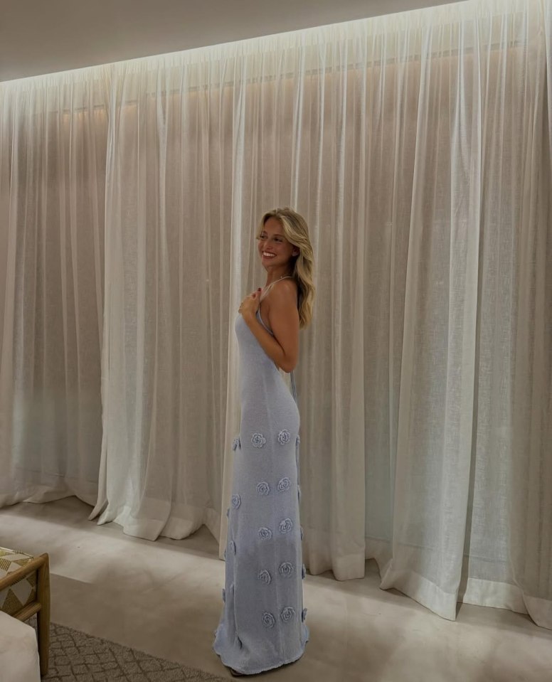 Margarida Corceiro in a light blue dress.