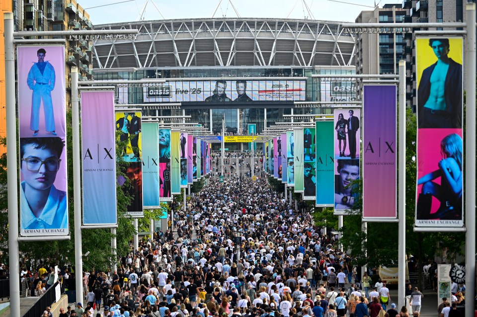Crowd of Oasis fans arriving at Wembley Stadium.