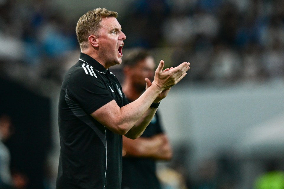 Eddie Howe, Newcastle United head coach, clapping during a match.