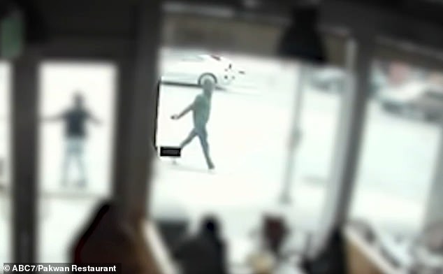 Surveillance footage from a nearby restaurant also captured Collins walking in the area dressed in an all black outfit