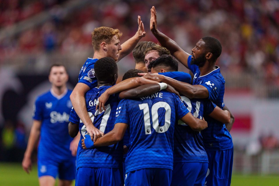 Everton soccer players celebrating a goal.