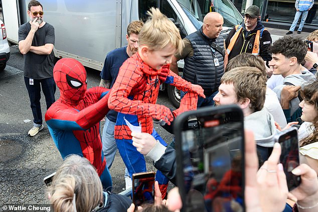 The British actor, 29, even unveiled his new Spidey suit ahead of filming the next chapter in the blockbuster franchise, Brand New Day – and gave one happy young fan a lift up