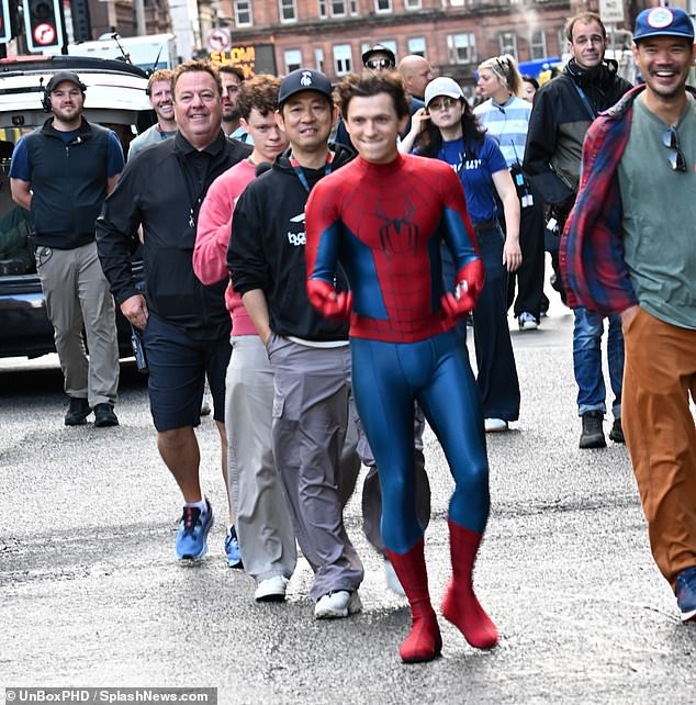 The actor even appeared to jokingly shoot webs from his Spider-Man suit as he made his way to the set of the role that has made him a global superstar