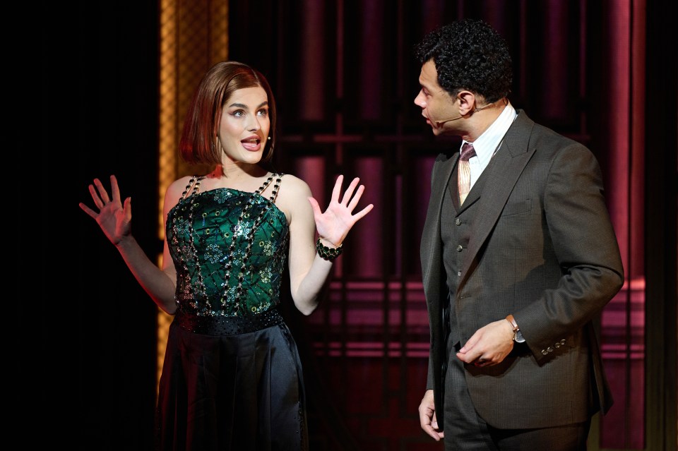 Amber Davies and Corbin Bleu performing in a theatrical production.