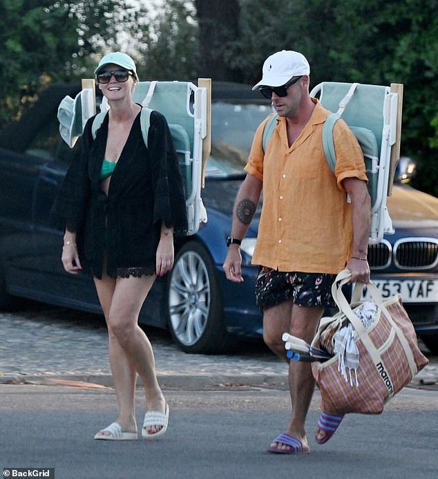 Enjoying a day at the beach on Tuesday, the presenter, 49, and his wife, 46, had some down time with friends