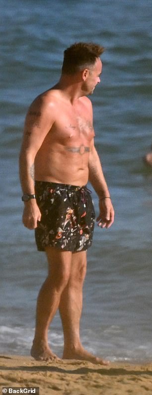 He wore a pair of floral swimming trunks