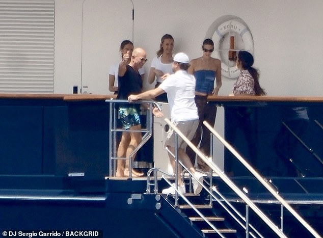 Jeff, 61, and Lauren, 55, opted for clashing prints, with Jeff layering a printed kimono over a bikini, while Jeff matched tropical swimming trunks with a navy T-shirt