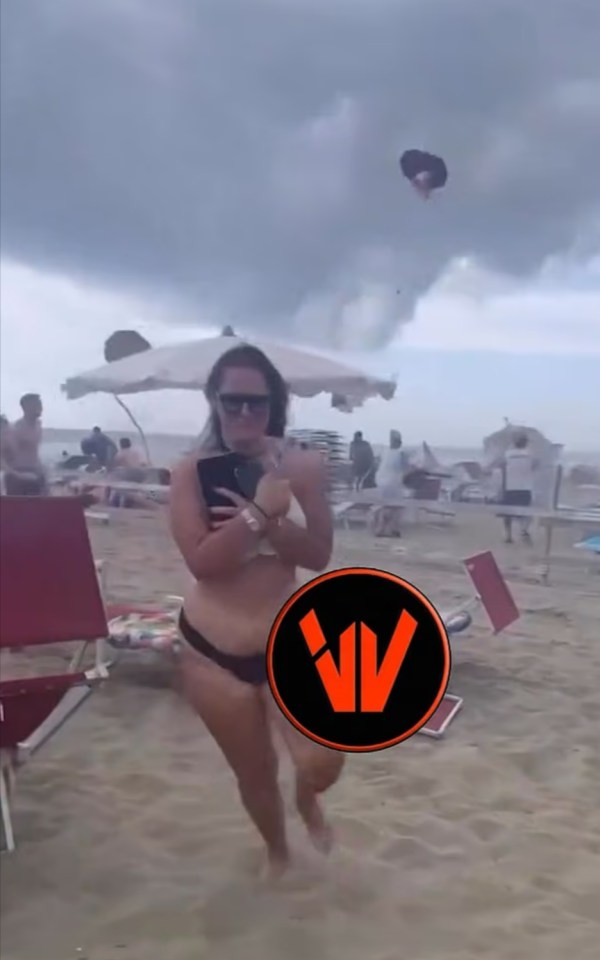 Tourists fleeing an Italian beach during a tornado.