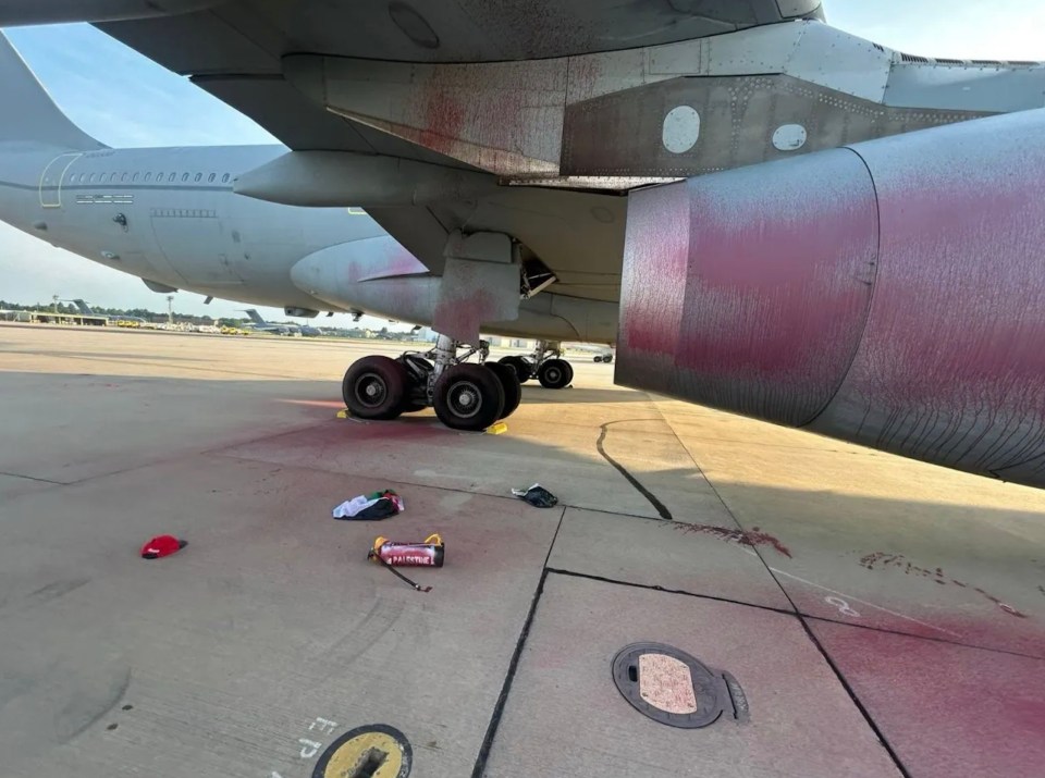 Pink paint sprayed on a military aircraft engine and ground.