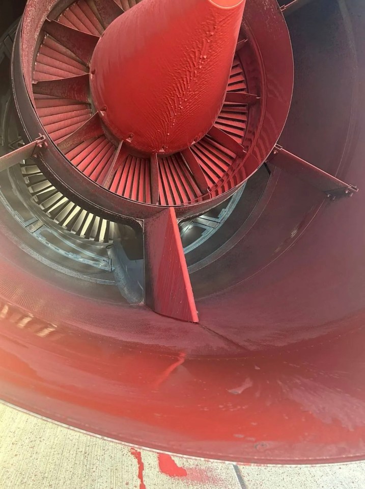 Red paint on military aircraft engine.