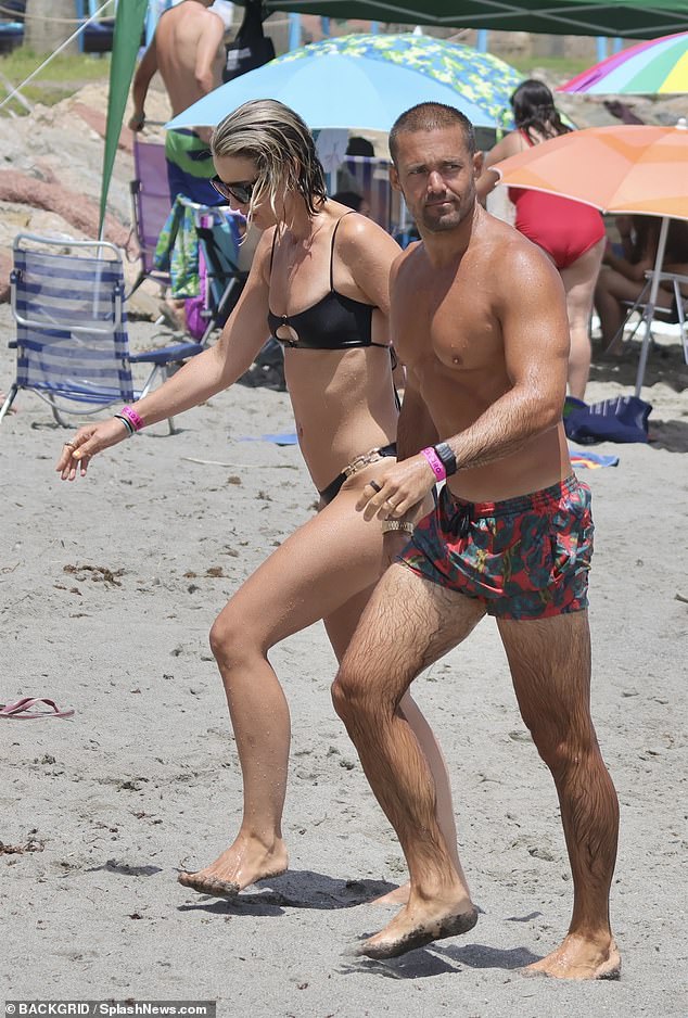 Meanwhile, Spencer went shirtless in a pair of colourful swimming shorts and showed off his tan