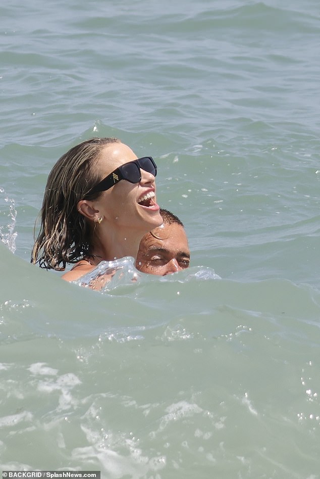 They were in high spirits as they cooled down in the water