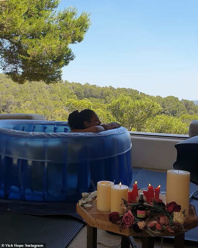 Calvin shared a picture of Vick relaxing in a birthing pool surrounded by candles