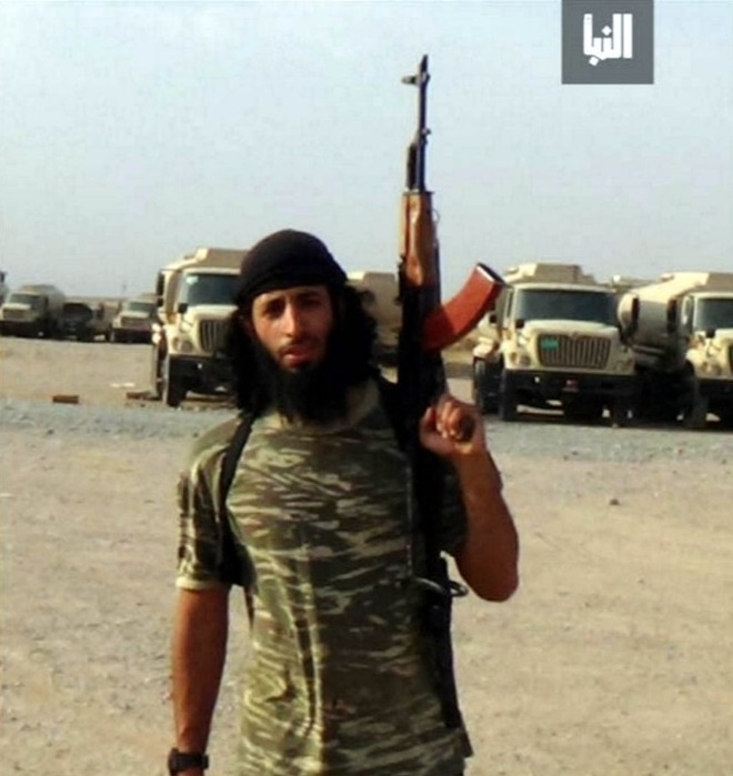Mandatory Credit: Photo by Tim Stewart News/REX/Shutterstock (5577657a) Jihadi John aka Mohammed Emwazi Jihadi John aka Mohammed Emwazi - Jan 2016 New unmasked picture of ISIS thug Jihadi John - Mohammed Emwazi - wearing combat gear and wielding an AK-47 in what is believed to be Syria. The picture was released by the Islamic State a week after the terror group confirmed his death.