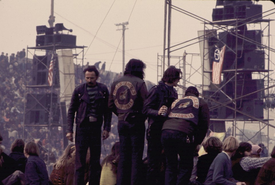 Photo of The Rolling Stones performing at the Altamont Speedway Free Festival with Hells Angels in the crowd.